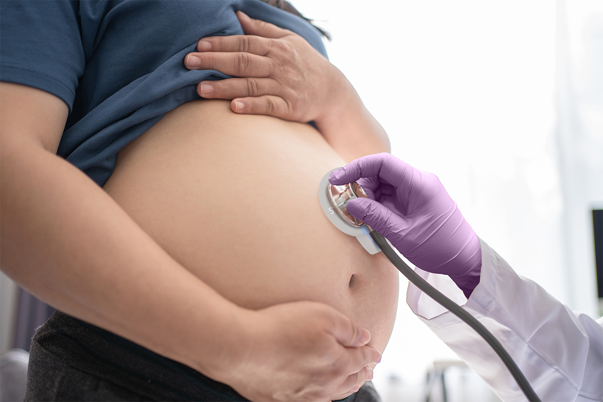 Clinician using a protected stethoscope during a prenatal examination